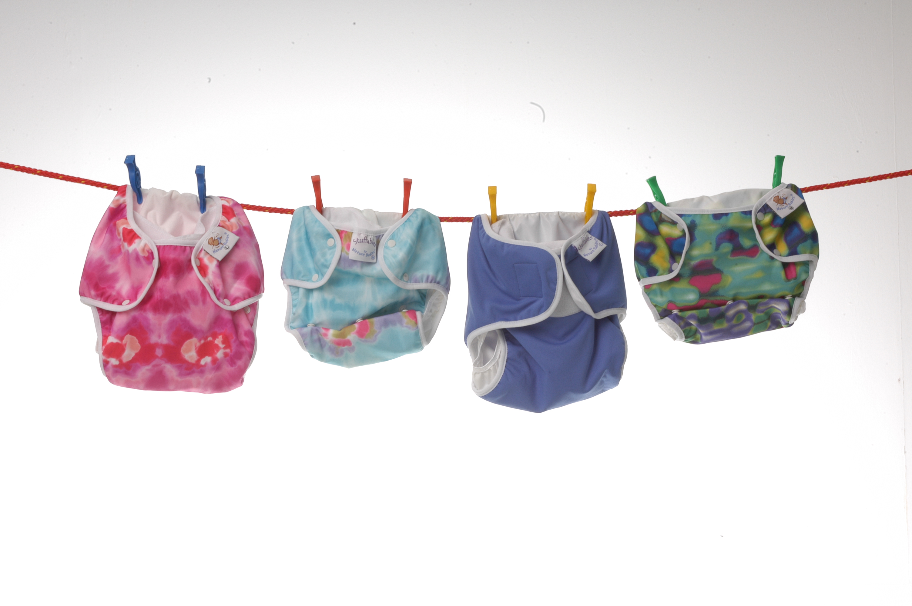 Cloth nappies hanging on a line. 