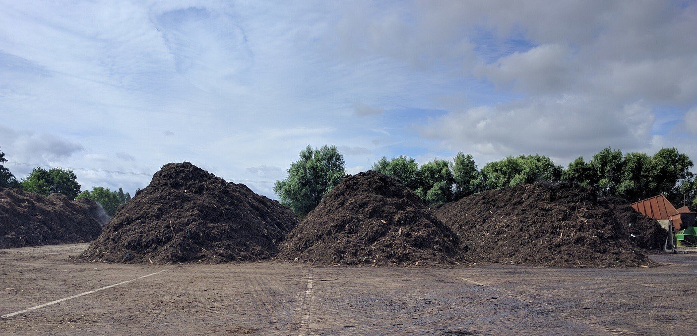 Three large piles of mud